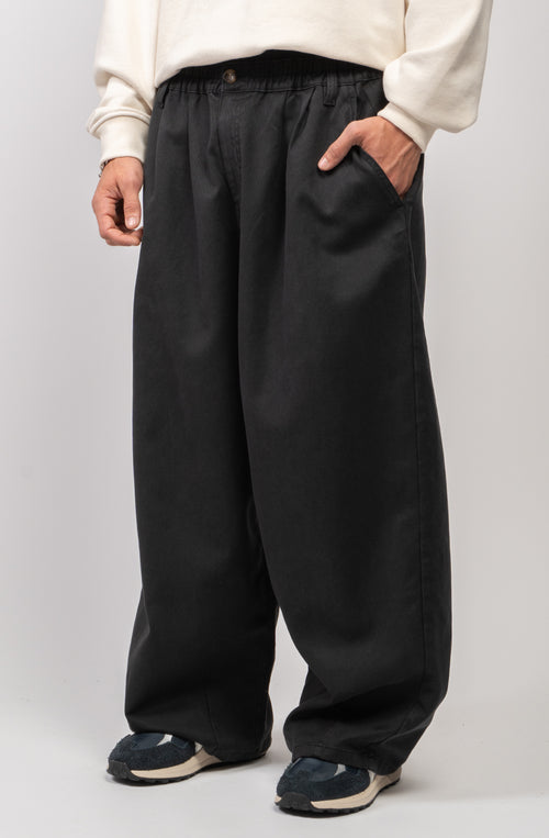 Schwarze Dandy-Hose mit weitem Bein