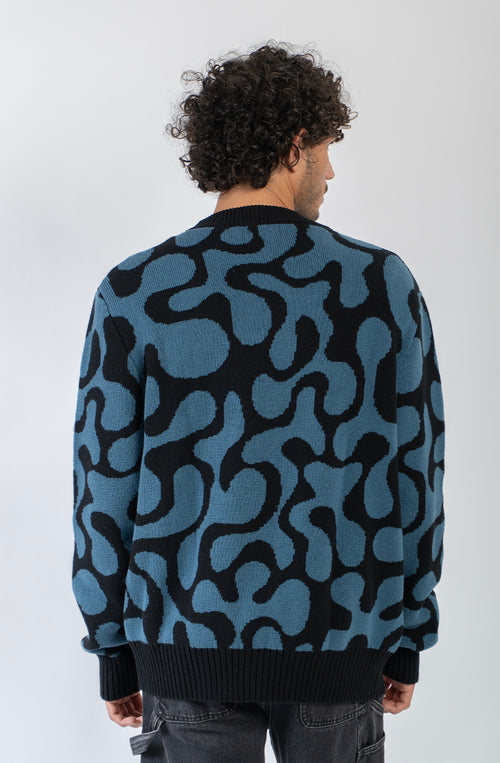 Cardigan unisex de punto con diseño jacquard azul y negro.