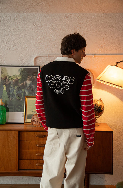 Chaleco unisex de punto negro con gráficos jacquard Breeze Club en blanco.