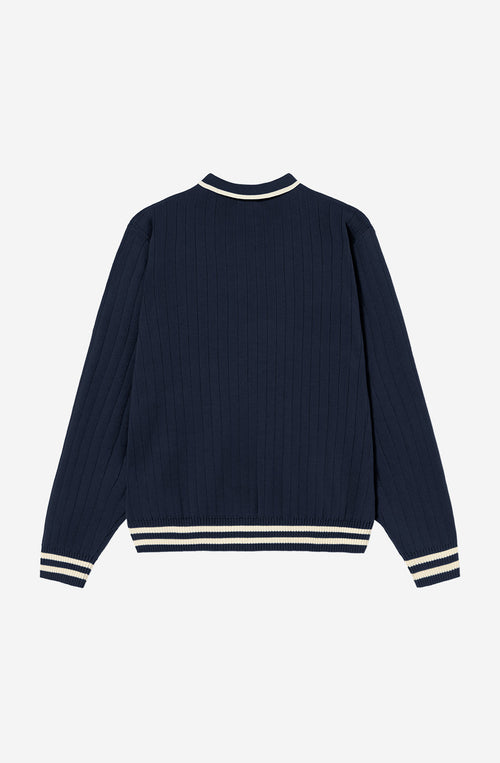 Polo unisex de punto azul marino de canalé con cuello de botones, detalles en contraste color crudo y bordado Kaotiko en el pecho.