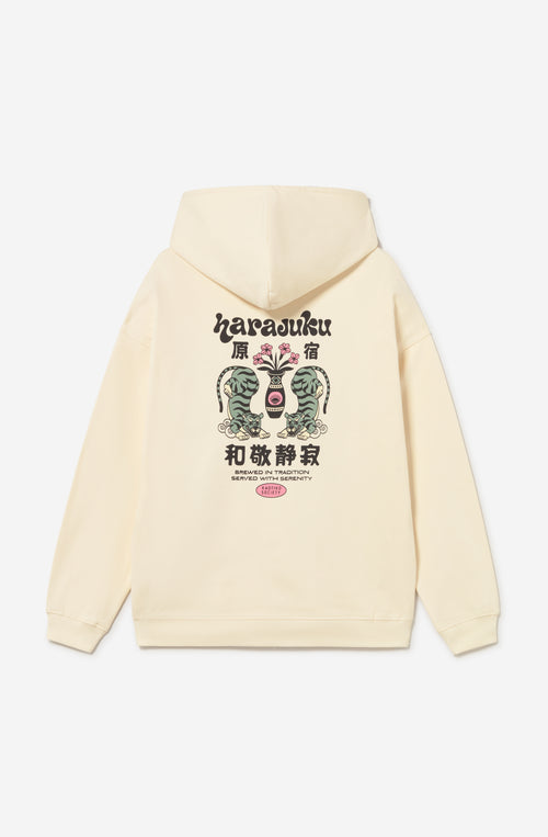 Sudadera oversize color ivory con capucha, estampado Harajuku en el pecho y gráfica trasera con tigres, flores y detalles de inspiración japonesa.