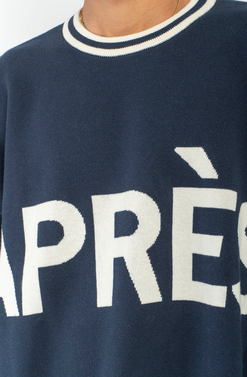 Jersey unisex azul marino de punto con gráfico APRÈS en el frontal, SKI en la espalda y detalles de canalé a contraste.
