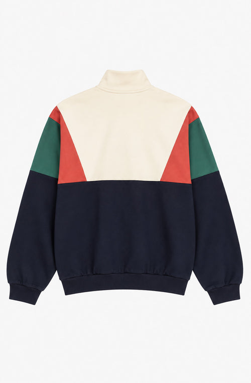 Sudadera unisex Arthur con cuello alto y media cremallera, diseño color block crudo, azul marino, verde y rojo, y logo Kaotiko en el pecho.